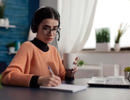 student-with-headphones-listening-to-online-course-2022-01-04-23-30-41-utc.jpg